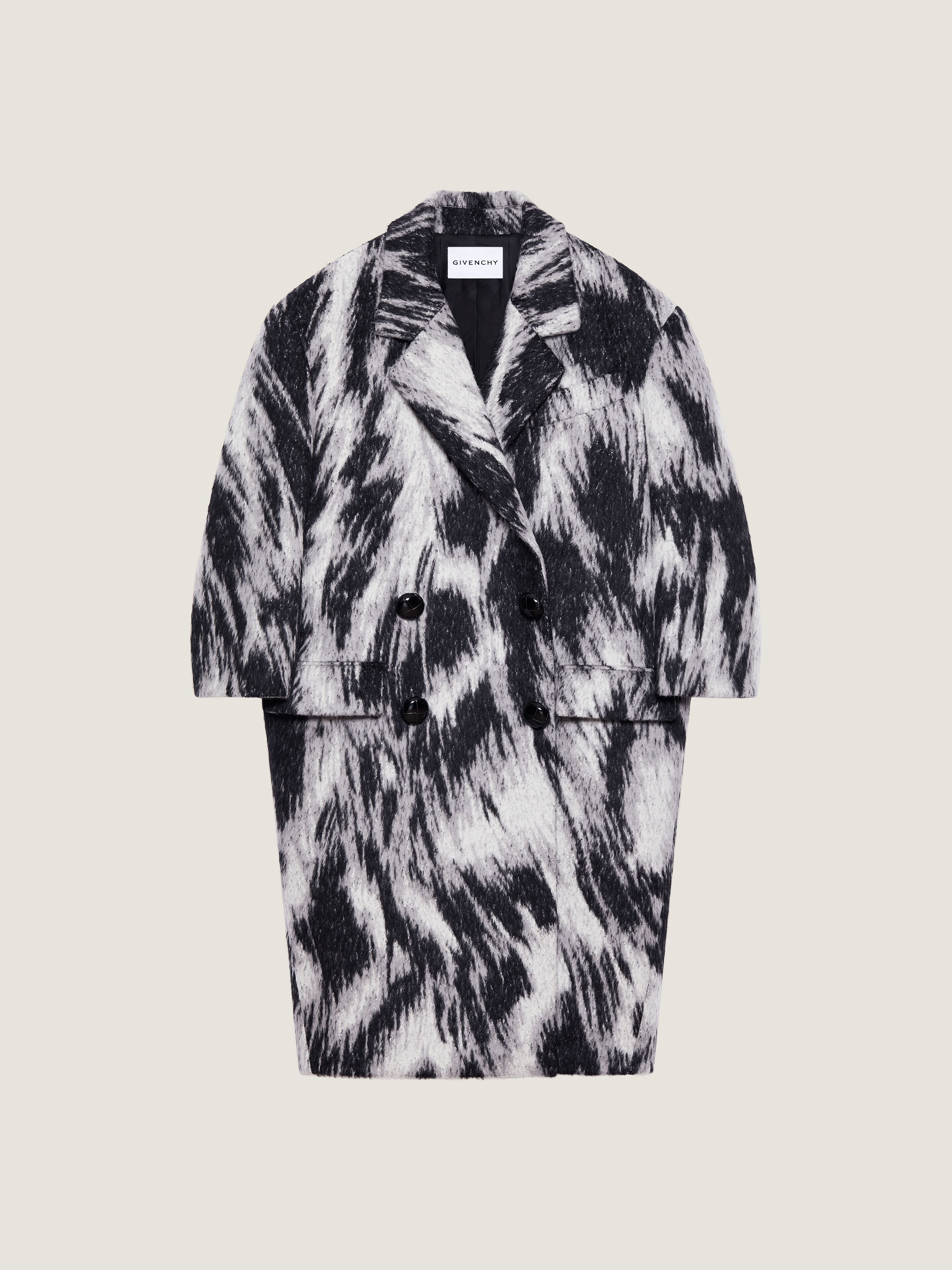 Coat in wool jacquard with animal print